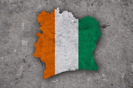 Map and flag of Ivory Coast on weathered concrete