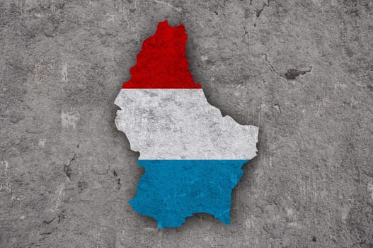 Map and flag of Luxembourg on weathered concrete