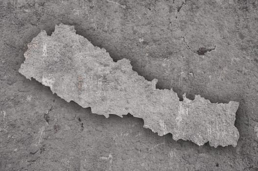 Map of Nepal on weathered concrete
