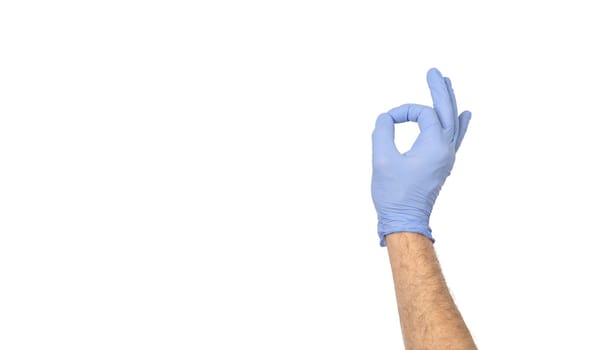Hands gestures. human hand in latex glove showing symbol of ok isolated on white background with copy space