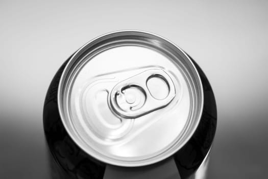 The lid of an aluminum beverage can from above.