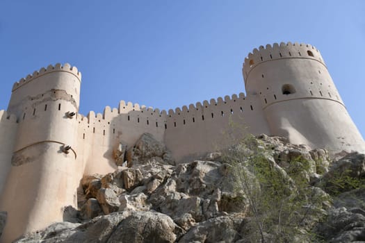 The Nakhal Nakhl Fort is a large fortress at the foot of the Hadshar Mountains in the Al Batinah region of Oman.