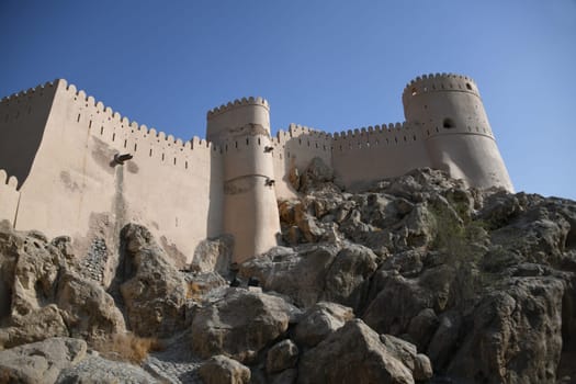 The Nakhal Nakhl Fort is a large fortress at the foot of the Hadshar Mountains in the Al Batinah region of Oman.