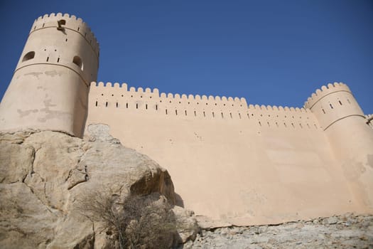 The Nakhal Nakhl Fort is a large fortress at the foot of the Hadshar Mountains in the Al Batinah region of Oman.