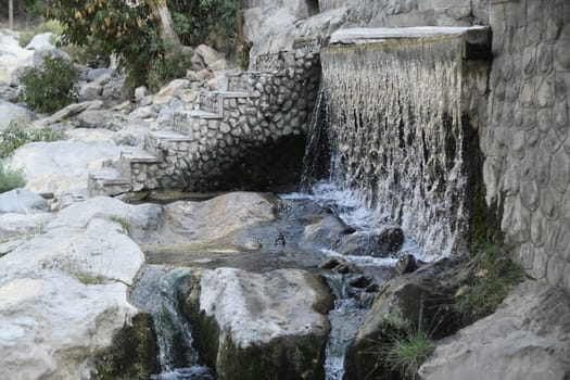 The famous hot springs Ain Al Thawarah in the Al Batinah region near the town of Nakhal Nakhl at the foot of the Hadshar Mountains in the Sultanate of Oman.