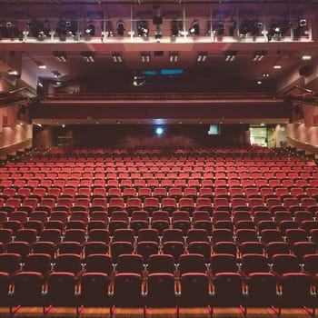Interior of modern empty red congress hall.
