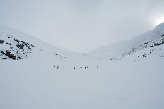 Tankhoy, Russia - January 20, 2019: Skiers ride in the snow in the mountains of Baikal