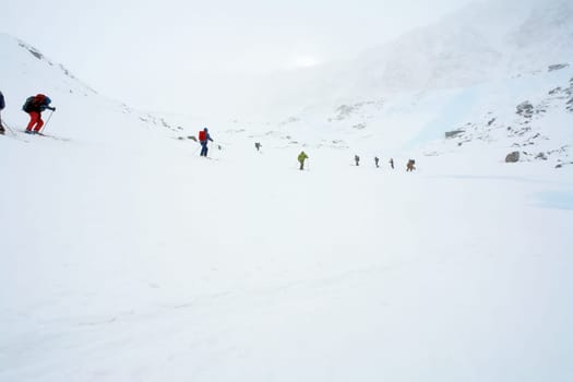 Tankhoy, Russia - January 20, 2019: Skiers ride in the snow in the mountains of Baikal