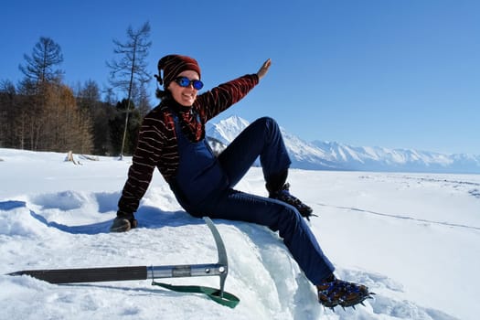 Tankhoy, Russia - January 20, 2019: Skiers at the ski base on Baikal. A ski on a sunny day.