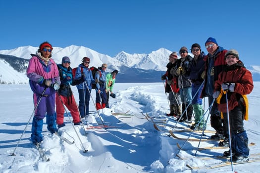 Tankhoy, Russia - January 20, 2019: Skiers at the ski base on Baikal. A ski on a sunny day.