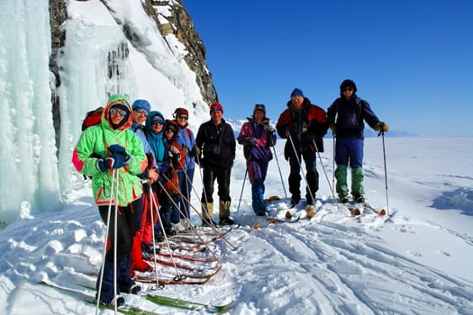 Tankhoy, Russia - January 20, 2019: Skiers at the ski base on Baikal. A ski on a sunny day.