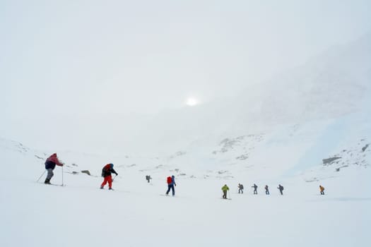 Tankhoy, Russia - January 20, 2019: Skiers ride in the snow in the mountains of Baikal