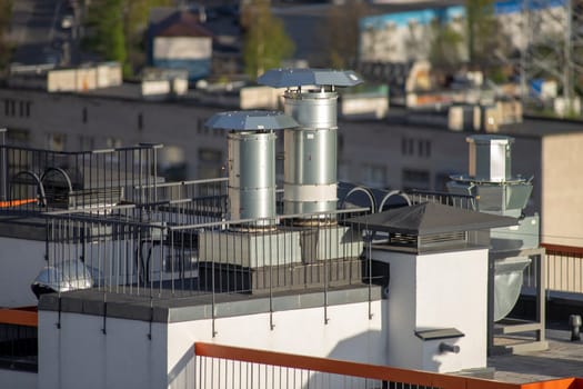 ventilation pipes on the roof of a high-rise building high angle view
