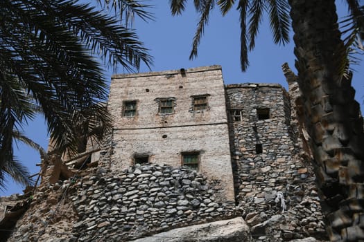 A house in the oasis of the mountain village Misfah in Oman where the famous Falaj irrigation system can be seen.
