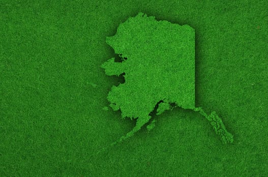 Map of Alaska on green felt