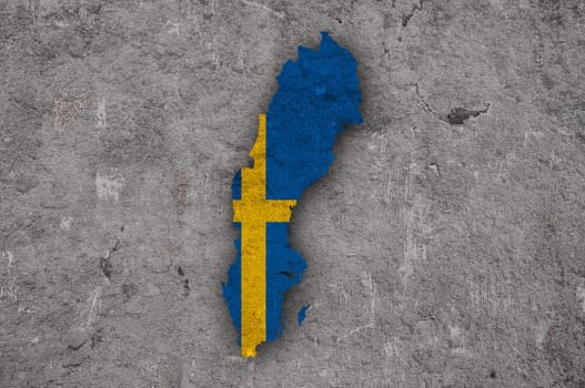 Map and flag of Sweden on weathered concrete