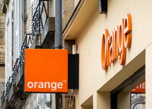 BAYONNE, FRANCE - CIRCA DECEMBER 2020: Orange sign at shop entrance in the town center.