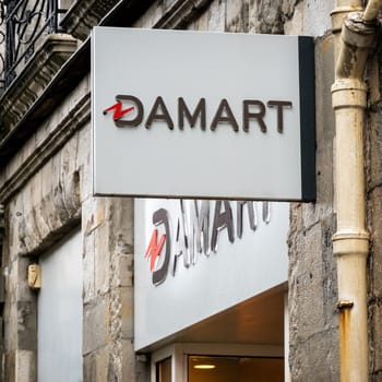 BAYONNE, FRANCE - CIRCA DECEMBER 2020: Damart sign at shop entrance in the town center.
