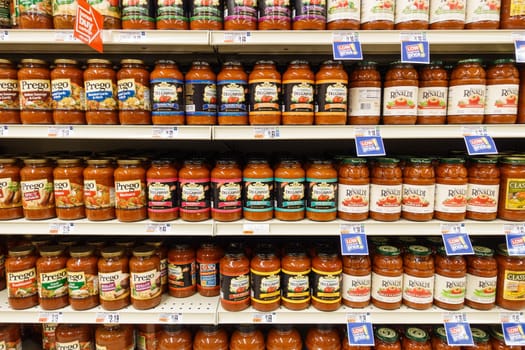 WILLIAMSBURG, VA, USA - CIRCA AUGUST 2015: Tomato sauce jars on supermarket shelves.