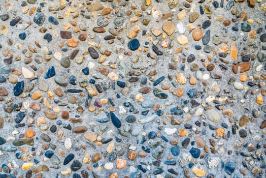 Small pebble and cement floor background texture