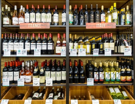 WILLIAMSBURG, VA, USA - CIRCA AUGUST 2015: French and Italian wines on shelves in supermarket.