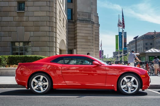 WASHINGTON, DC, USA - CIRCA AUGUST 2015: A red Chevrolet Camaro parked in the street.