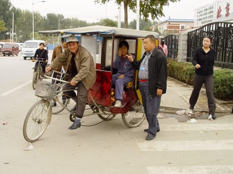 Hong Kong, China - June 24, 2019: Cycling taxi in Hong Kong. tricycle in the city