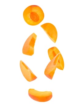 Flying fruit. Seven pieces of falling apricot fruits isolated on withe background with clipping path as package design element and advertising. Full depth of field.