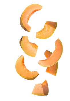 Flying fruit. Seven pieces of falling melon fruits isolated on withe background with clipping path as package design element and advertising. Full depth of field.