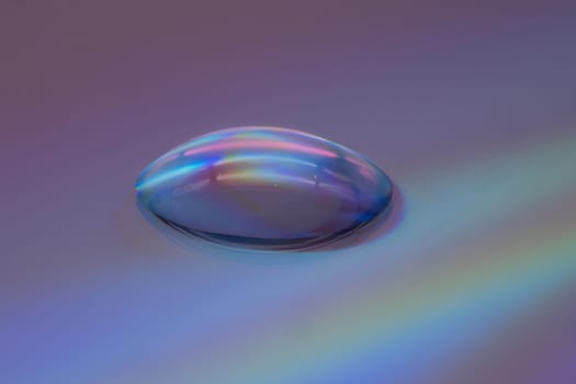 Drop Extreme Close Up, studio shot of water drop on dvd
