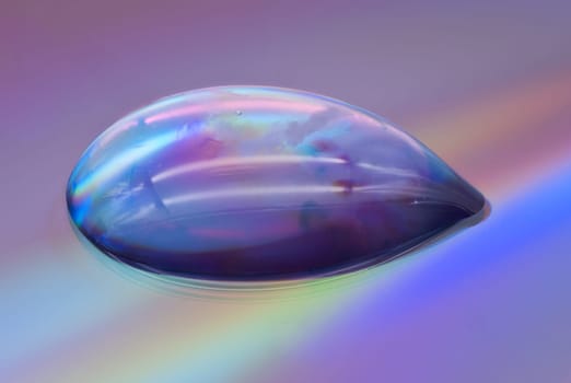 Drop Extreme Close Up, studio shot of water drop on dvd