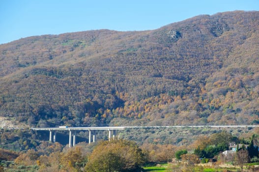 Truck crossing Ambroz Valley through Autovia A-66 bridge. The major highway in western Spain