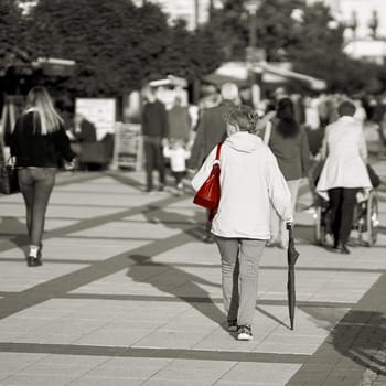 colorkey, Pedestrians on the beach promenade of Swinoujscie in Poland