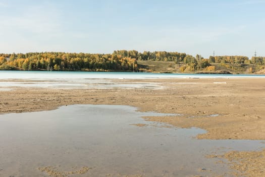 The water in the ash dump seems as beautiful as on postcards from distant seaside resorts.