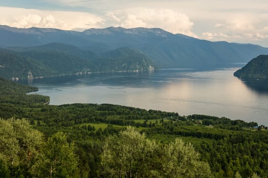Lake Teletskoye with calm water on a summer day