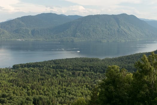 Lake Teletskoye with calm water on a summer day