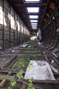 an old destroyed train car, an abandoned train. Devastation.