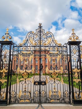 Kensington Palace gates in Kensington Gardens London England UK which was designed by Sir Christopher Wren for William III in 1689 and is a popular travel destination tourist attraction landmark