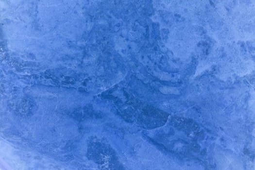 The texture of the marble under the magn up. Marble stone.