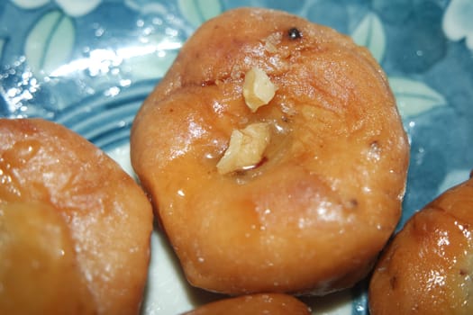 Closeup of delicious and tasty Asian sweet dish called balu shahi or baloshahi or balushahi. This dish is street sweet found in Pakistan India and Bangladesh and served in the festivities.