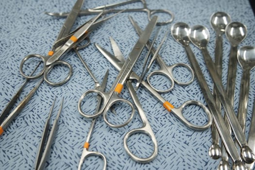 close-up view of sterile medical instruments for surgery on a table in operation theater
