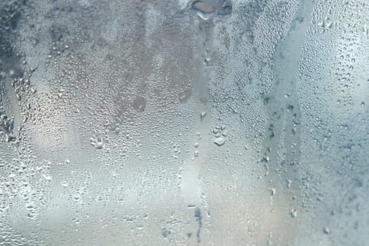 Bright grey color glassy texture, with water drops on it: abstract background