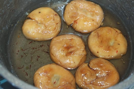 Closeup of delicious and tasty Asian sweet dish called balu shahi or baloshahi or balushahi. This dish is street sweet found in Pakistan India and Bangladesh and served in the festivities.