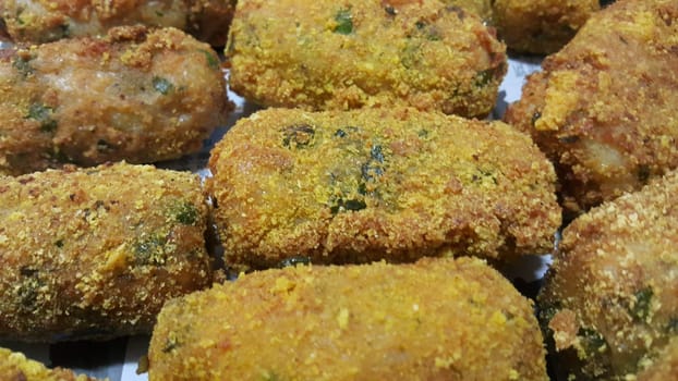 Closeup perspective view of home made spicy and delicious croquettes served with tea or other dishes during parties as fast food.