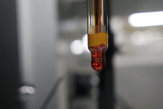Close-up view of pH meter, a device for measuring pH with equipment for analysis of solutions quality in a chemical laboratory