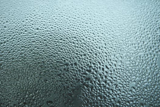Bright grey color glassy texture, with water drops on it. Water drop glassy background