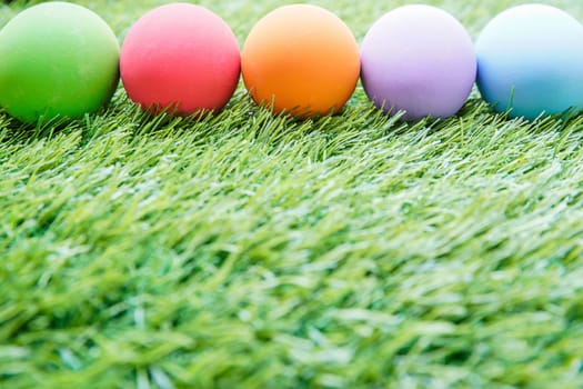 Close up Colorful easter eggs on on green gras background