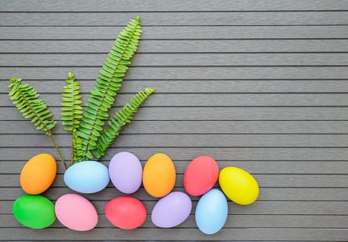 Close up Colorful easter eggs on wood table background with space