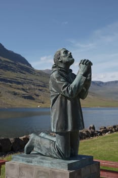 Eskifjodur, Iceland - August 08, 2017: An iconic statue in Eskifjodur, the statue dedicated to victims of sea in Eastern Iceland.