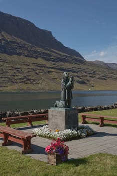 Eskifjodur, Iceland - August 08, 2017: An iconic statue in Eskifjodur, the statue dedicated to victims of sea in Eastern Iceland.